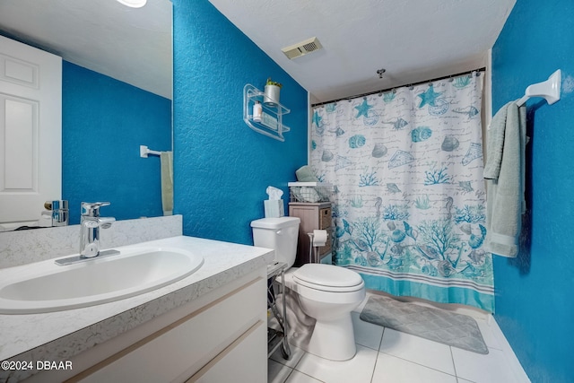 bathroom with vanity, curtained shower, tile patterned flooring, and toilet