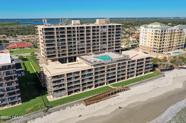 bird's eye view featuring a view of the beach and a water view