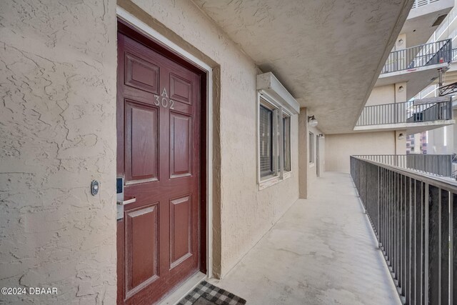 property entrance with a balcony