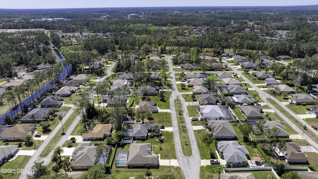 aerial view with a residential view and a view of trees