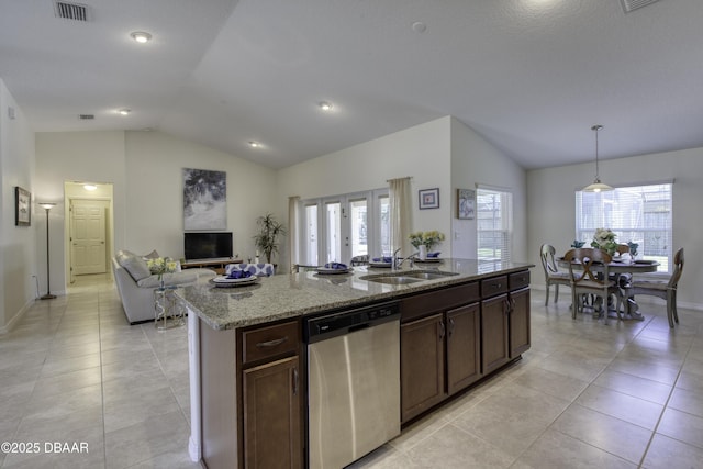 kitchen with visible vents, dishwasher, lofted ceiling, and a sink