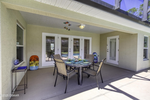 view of patio with french doors and outdoor dining area