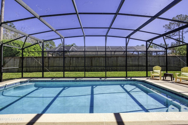 view of pool with a lanai, a fenced in pool, a patio, and a fenced backyard