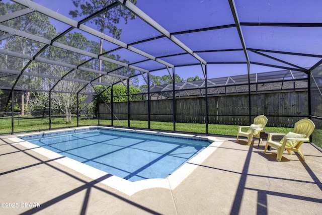 view of swimming pool with glass enclosure, a patio, fence, and a fenced in pool