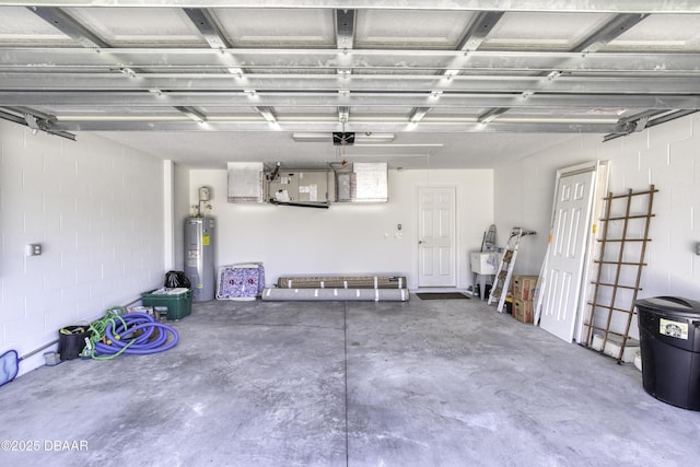 garage featuring electric water heater and concrete block wall