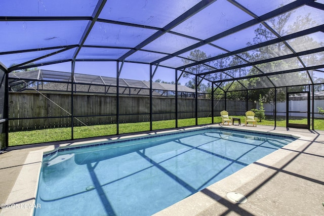 view of swimming pool with a lawn, a patio, a fenced backyard, a fenced in pool, and a lanai