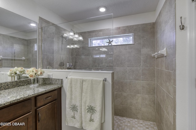 bathroom with vanity and a walk in shower