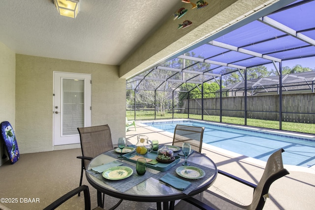 view of patio featuring a lanai and a fenced in pool