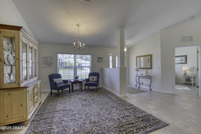 living area featuring light tile patterned floors, baseboards, visible vents, an inviting chandelier, and vaulted ceiling