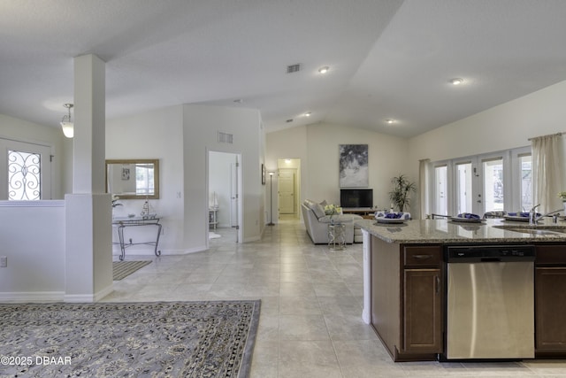 kitchen with visible vents, dark brown cabinets, open floor plan, dishwasher, and lofted ceiling