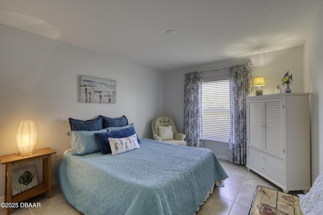 bedroom with light tile patterned floors