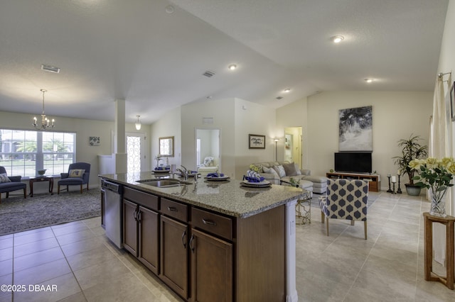 kitchen with open floor plan, dishwasher, visible vents, and a sink