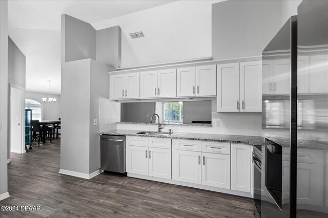 kitchen with stainless steel appliances, white cabinetry, and sink