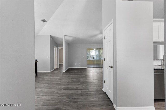 corridor with dark wood-type flooring