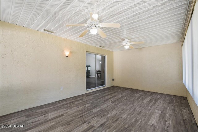 unfurnished sunroom featuring ceiling fan