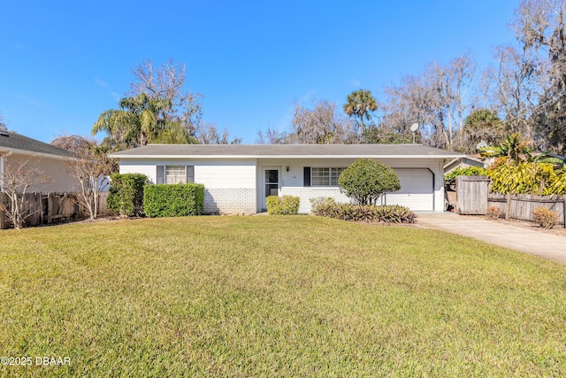 single story home with a garage and a front lawn