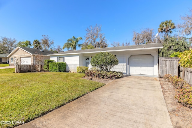 ranch-style house featuring a garage and a front yard