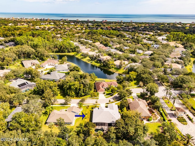 drone / aerial view with a water view