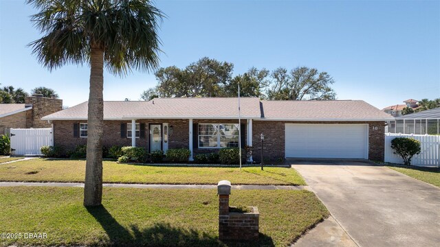 single story home with a front lawn, an attached garage, and fence