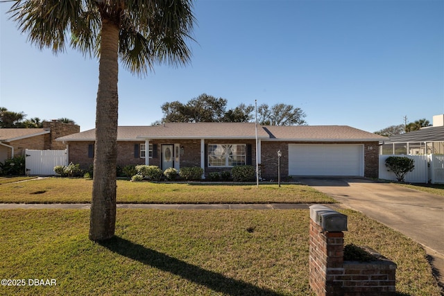 single story home featuring fence, an attached garage, concrete driveway, a front lawn, and brick siding