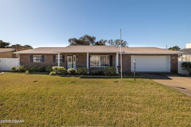 ranch-style house featuring a front lawn, fence, concrete driveway, a garage, and brick siding