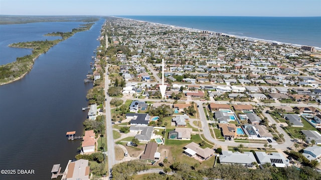 birds eye view of property with a residential view and a water view