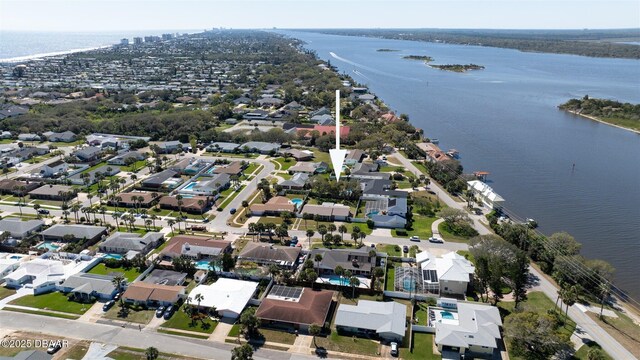 aerial view with a water view and a residential view