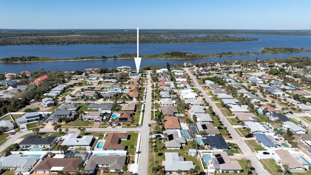 bird's eye view featuring a water view and a residential view