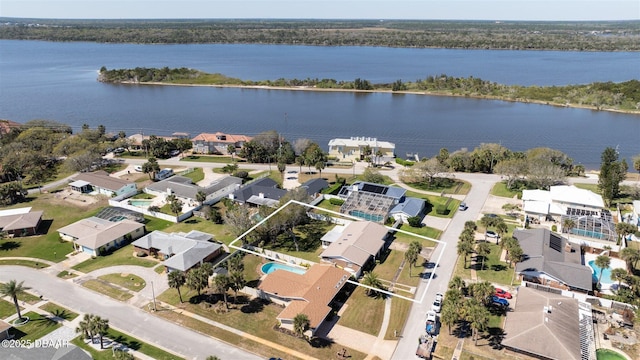 bird's eye view featuring a residential view and a water view