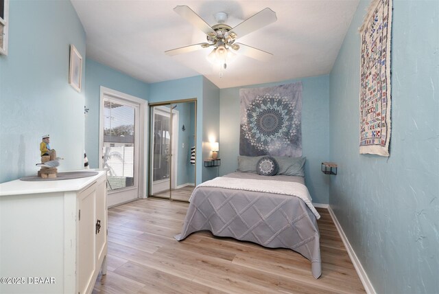 bedroom with a ceiling fan, access to outside, baseboards, and light wood-type flooring