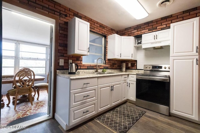 kitchen with white cabinets, under cabinet range hood, and stainless steel electric stove