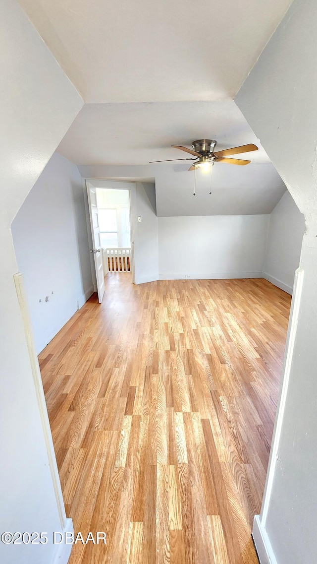 524 W St, Daytona Beach, FL 32114 - additional living space with light wood-type flooring, ceiling fan, vaulted ceiling, and baseboards