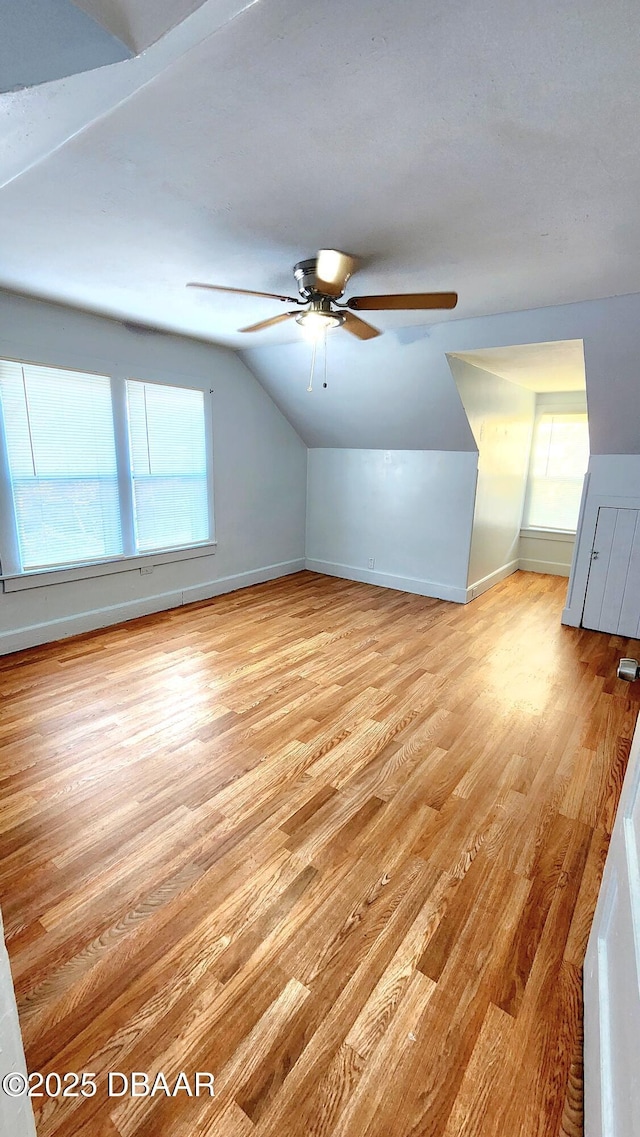524 W St, Daytona Beach, FL 32114 - bonus room featuring light wood-style floors, a ceiling fan, vaulted ceiling, and baseboards