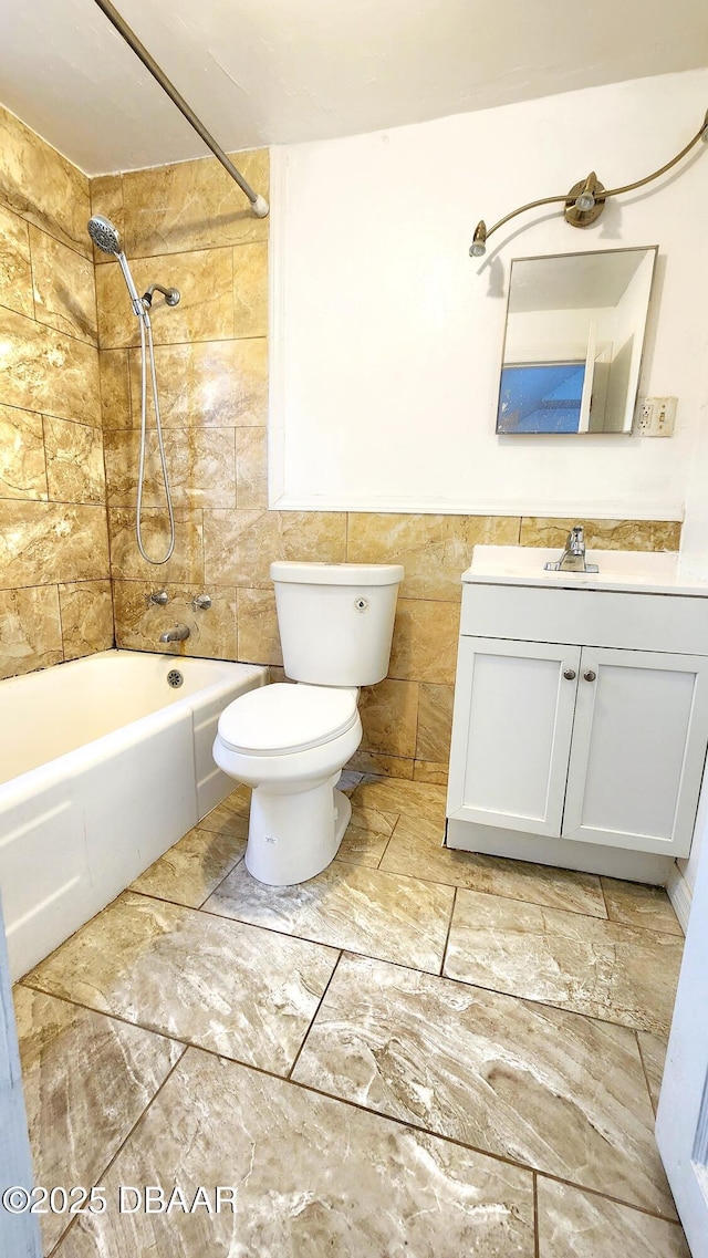 524 W St, Daytona Beach, FL 32114 - bathroom with vanity, toilet, shower / tub combination, and tile walls