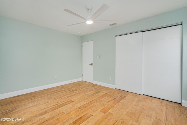 unfurnished bedroom featuring a closet, ceiling fan, and light hardwood / wood-style floors