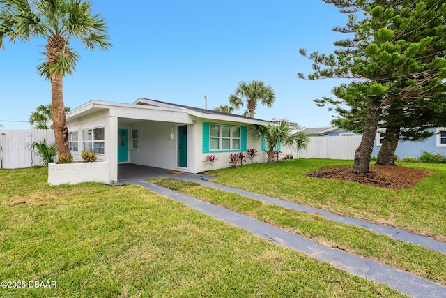 single story home with a carport and a front yard