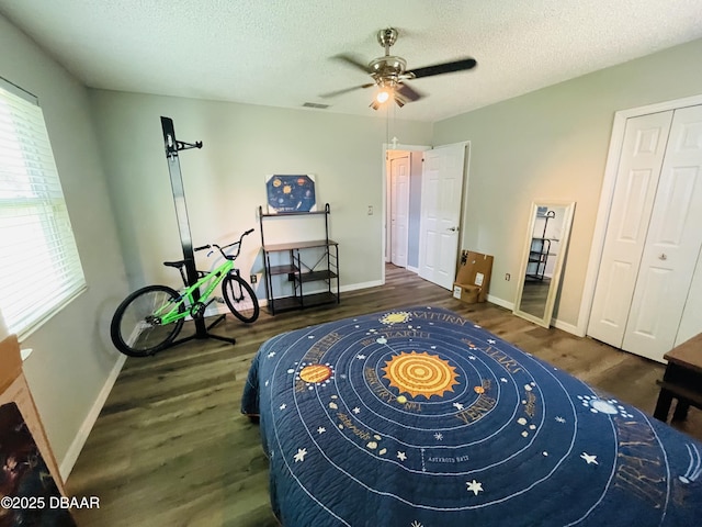 3565 E Lake Dr, Land Olakes, FL 34639 - bedroom with wood finished floors, baseboards, a textured ceiling, and ceiling fan