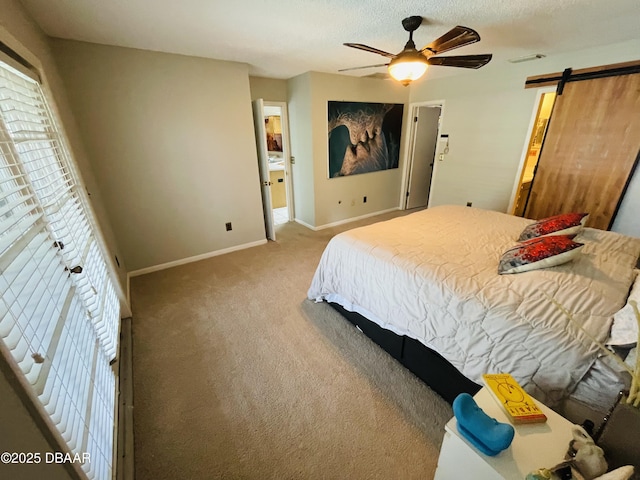 3565 E Lake Dr, Land Olakes, FL 34639 - bedroom featuring carpet flooring, a barn door, baseboards, and ceiling fan