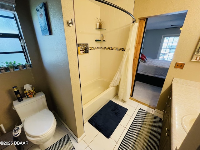 3565 E Lake Dr, Land Olakes, FL 34639 - full bathroom featuring toilet, ensuite bathroom, tile patterned floors, shower / bathtub combination with curtain, and vanity