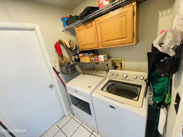 3565 E Lake Dr, Land Olakes, FL 34639 - washroom featuring separate washer and dryer, cabinet space, and light tile patterned floors