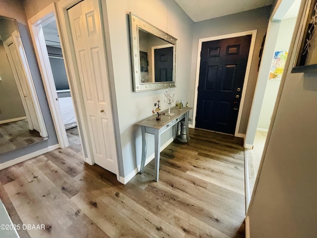 3565 E Lake Dr, Land Olakes, FL 34639 - foyer featuring wood finished floors and baseboards