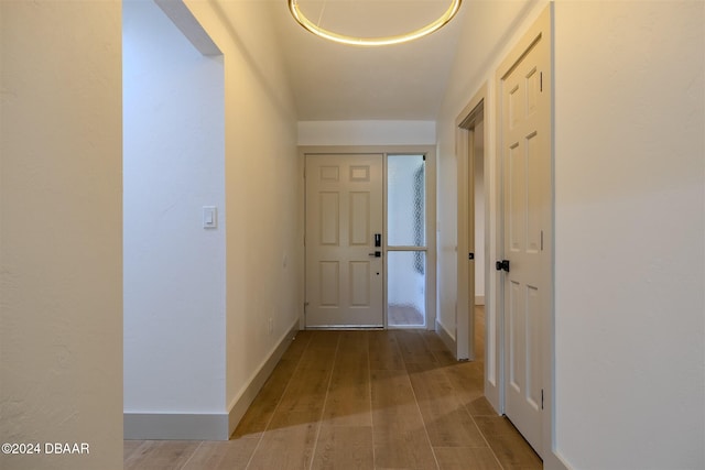 hall with light hardwood / wood-style floors