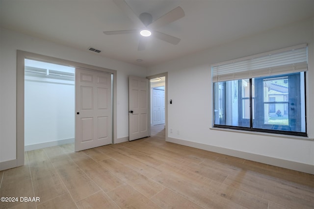 unfurnished bedroom featuring ceiling fan and light hardwood / wood-style flooring