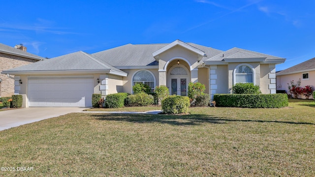 single story home with a garage and a front lawn