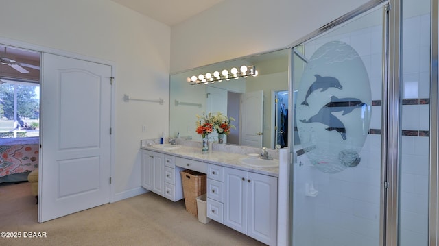 bathroom with walk in shower, ceiling fan, and vanity