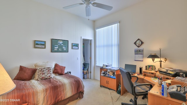 bedroom featuring light carpet and ceiling fan