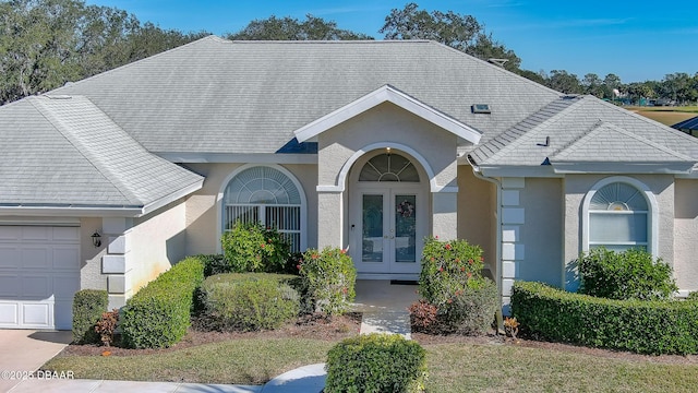 view of front of home featuring a garage and french doors