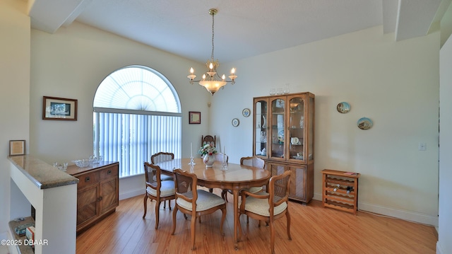 dining room featuring a chandelier and light hardwood / wood-style flooring