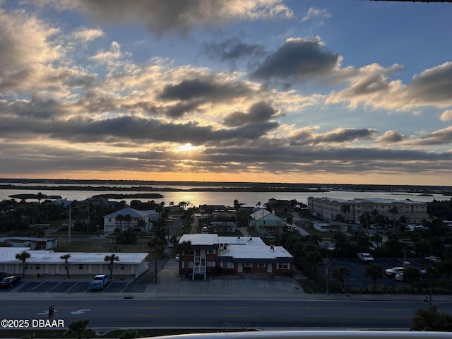 aerial view at dusk with a water view