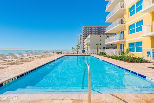 view of swimming pool featuring a patio